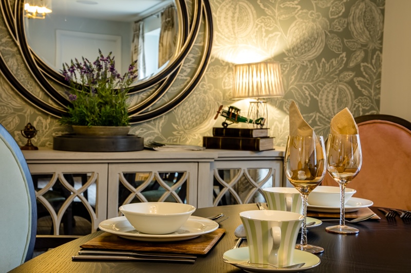 Dining area in Priorslee House with plates and utensils